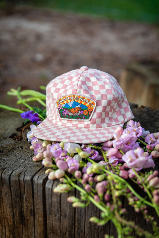 Growing in the Sierra hat, pink checkerboard